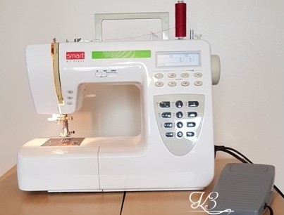 Domestic sewing machine with basic stitches and accessories